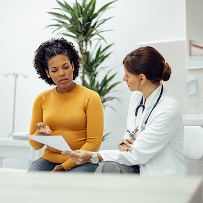 Woman speaking with her doctor